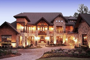 Craftsman High-country style house with porte-cochere and stone exterior.