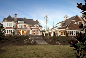 Shingle style home with pool and pool house.