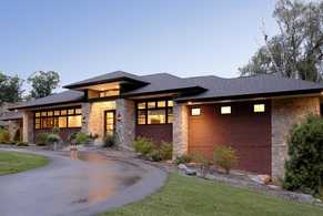 Prairie style home with modern architectural detail.